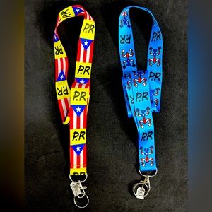 Lanyarn set of 2. New. Reversible. “Puerto Rico Flag”and “Coqui Taino” prints.